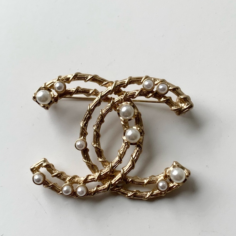 Authentic Chanel brooches with faux pearl